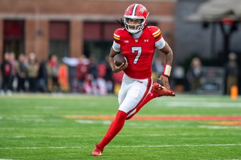 Nov 22, 2025; College Park, Maryland, USA;  Maryland Terrapins quarterback Malik Washington (7) scrambles during the first quarter against the Michigan Wolverines at SECU Stadium. Mandatory Credit: Tommy Gilligan-Imagn Images