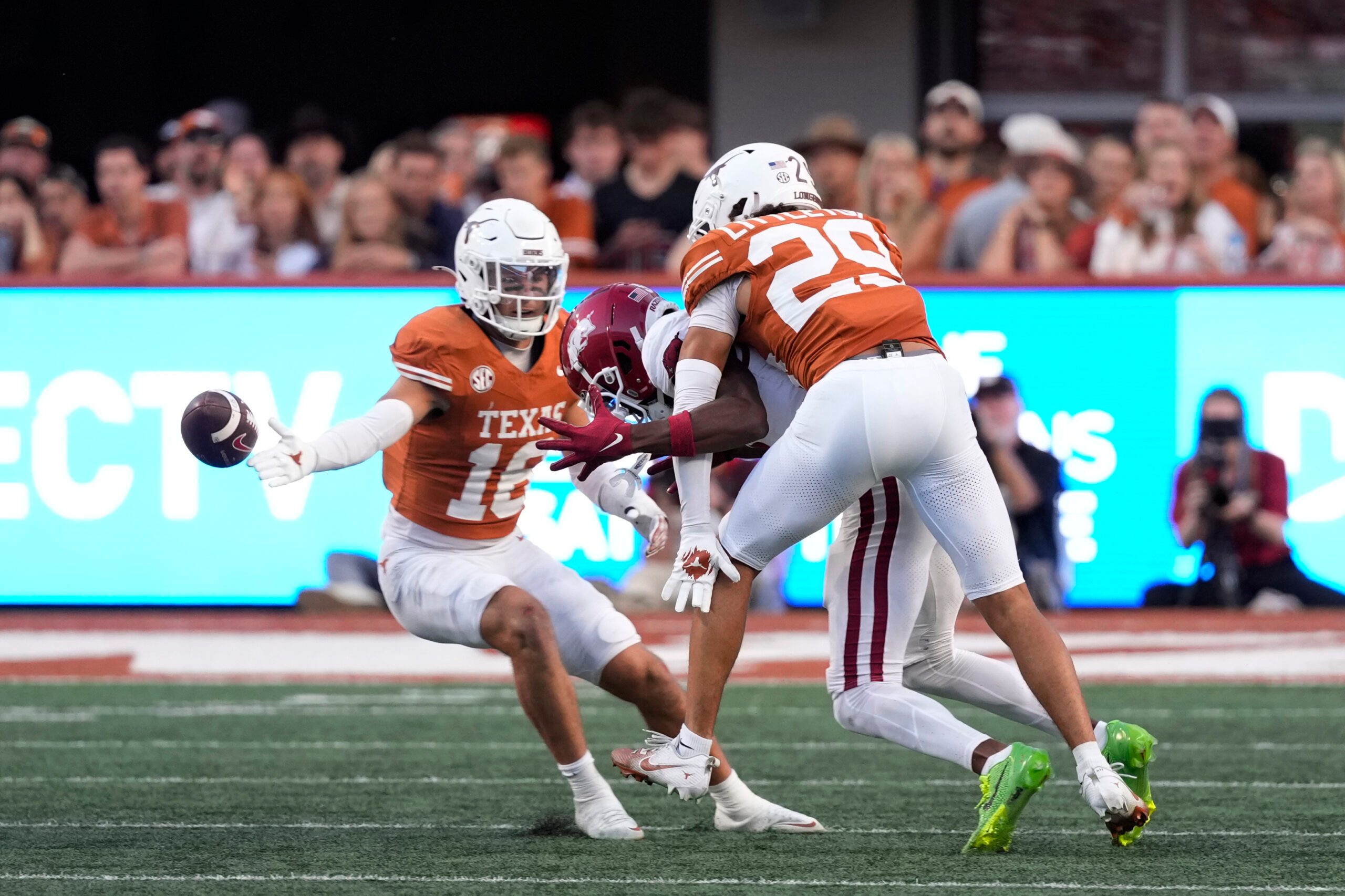Nov 22, 2025; Austin, Texas, USA; Texas Longhorns defensive back Graceson Littleton (29) breaks up a pass ahead teammate Michael Taaffe (16) during the second half against the Arkansas Razorbacks at Darrell K Royal-Texas Memorial Stadium. Mandatory Credit: Scott Wachter-Imagn Images