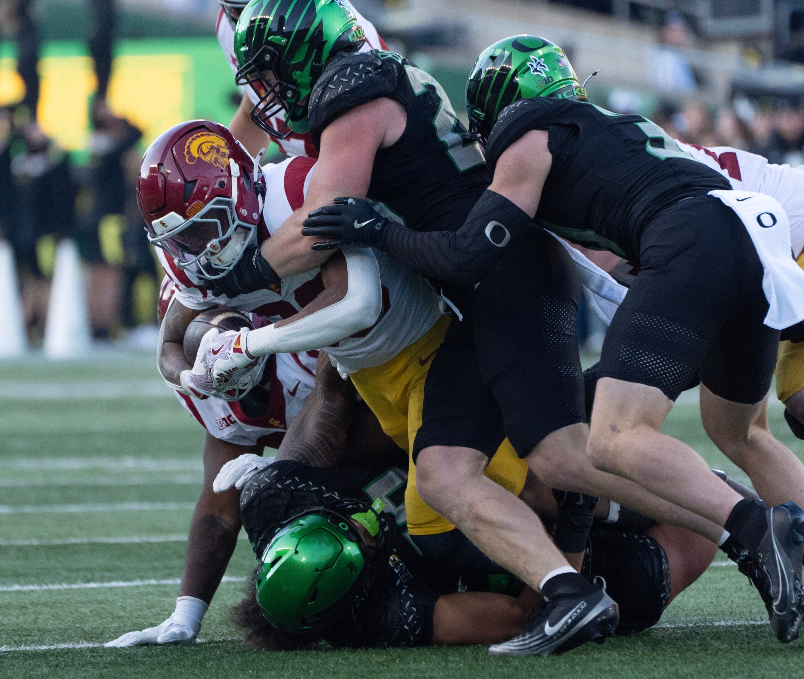 The Oregon defense piles up Southern California running back King Miller during the second half Nov. 22, 2025.