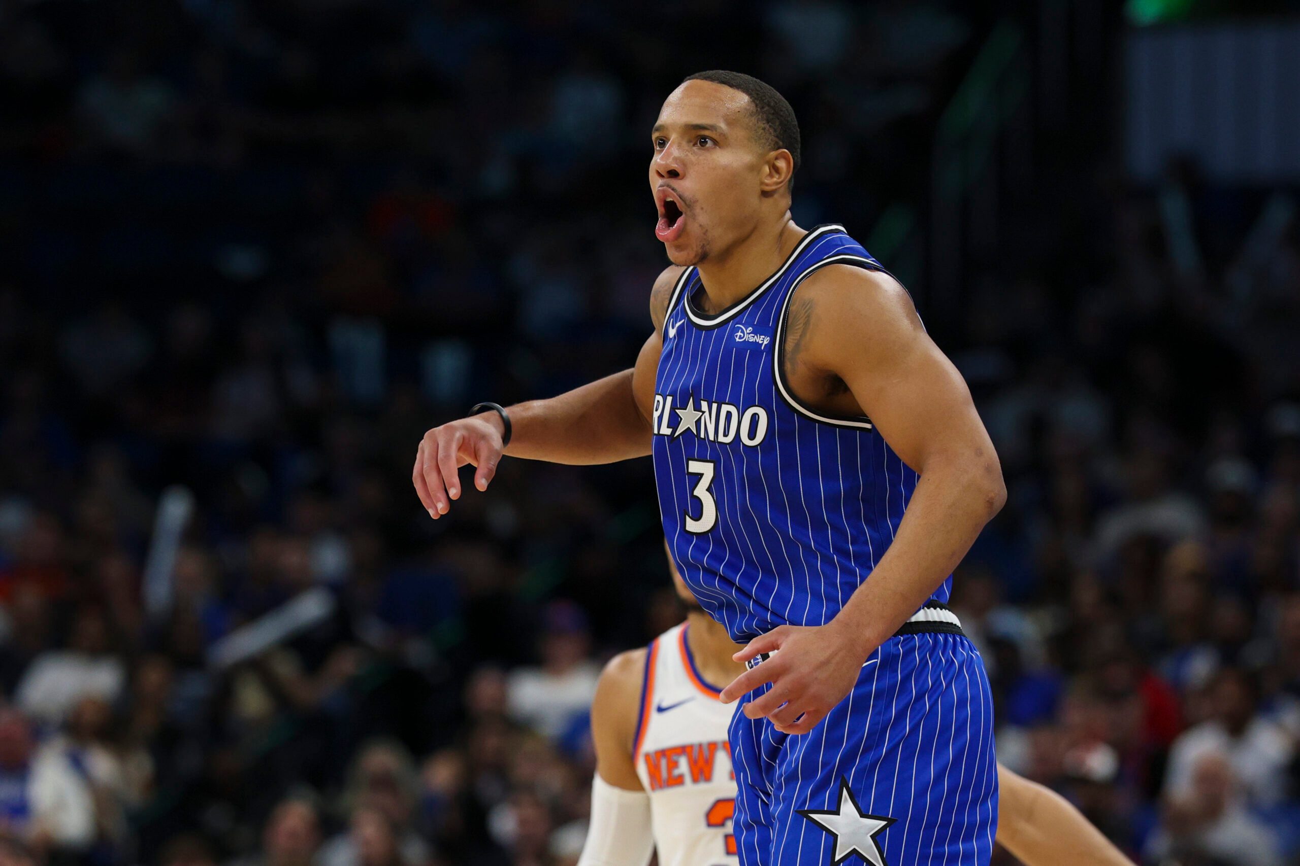 Nov 22, 2025; Orlando, Florida, USA; Orlando Magic guard Desmond Bane (3) reacts after a play against the New York Knicks in the third quarter at Kia Center. Mandatory Credit: Nathan Ray Seebeck-Imagn Images
