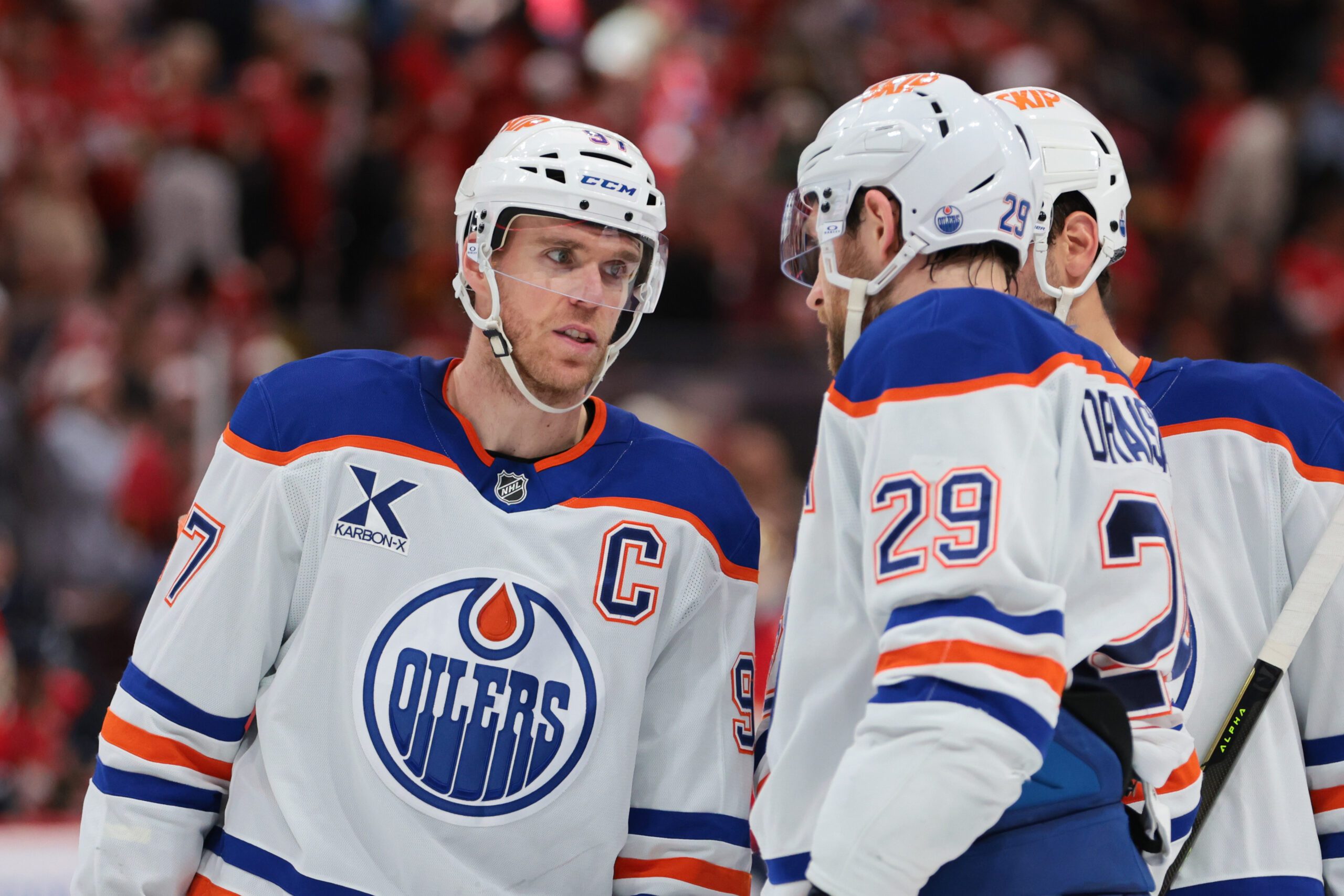 Nov 22, 2025; Sunrise, Florida, USA; Edmonton Oilers center Connor McDavid (97) speaks to center Leon Draisaitl (29) against the Florida Panthers during the second period at Amerant Bank Arena. Mandatory Credit: Sam Navarro-Imagn Images