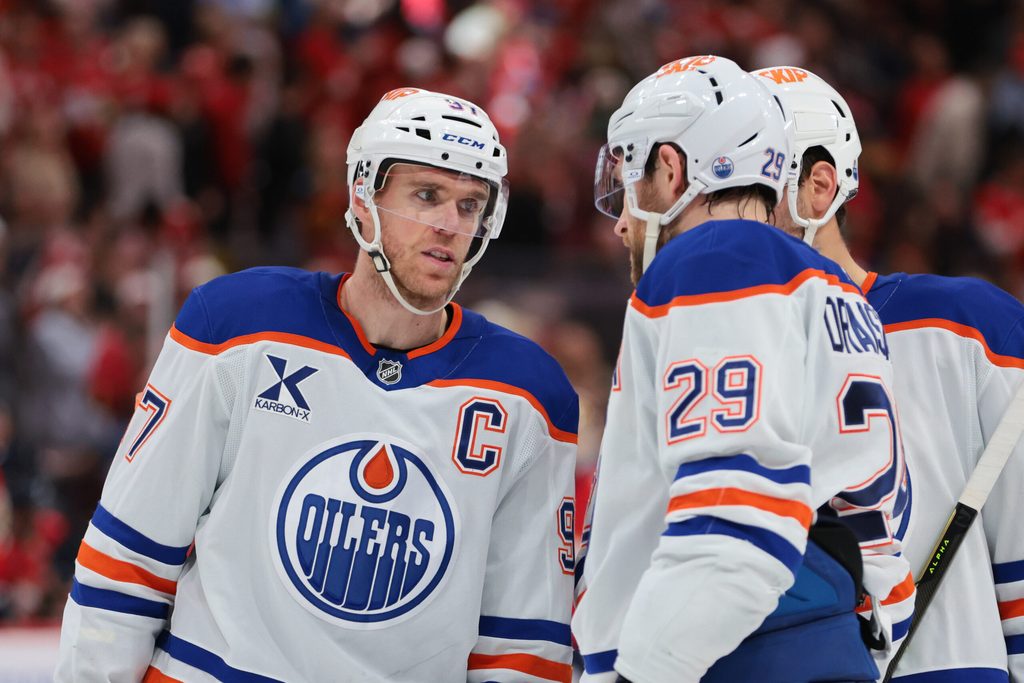 Nov 22, 2025; Sunrise, Florida, USA; Edmonton Oilers center Connor McDavid (97) speaks to center Leon Draisaitl (29) against the Florida Panthers during the second period at Amerant Bank Arena. Mandatory Credit: Sam Navarro-Imagn Images