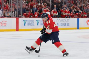 Nov 22, 2025; Sunrise, Florida, USA; Florida Panthers left wing Brad Marchand (63) moves the puck against the Edmonton Oilers during the third period at Amerant Bank Arena. Mandatory Credit: Sam Navarro-Imagn Images