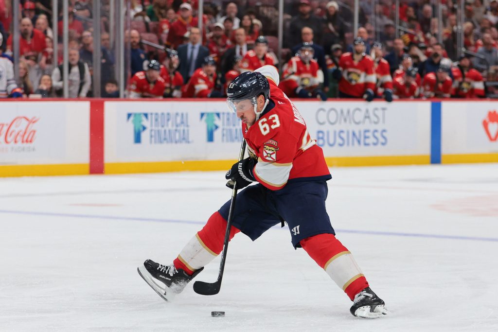 Nov 22, 2025; Sunrise, Florida, USA; Florida Panthers left wing Brad Marchand (63) moves the puck against the Edmonton Oilers during the third period at Amerant Bank Arena. Mandatory Credit: Sam Navarro-Imagn Images