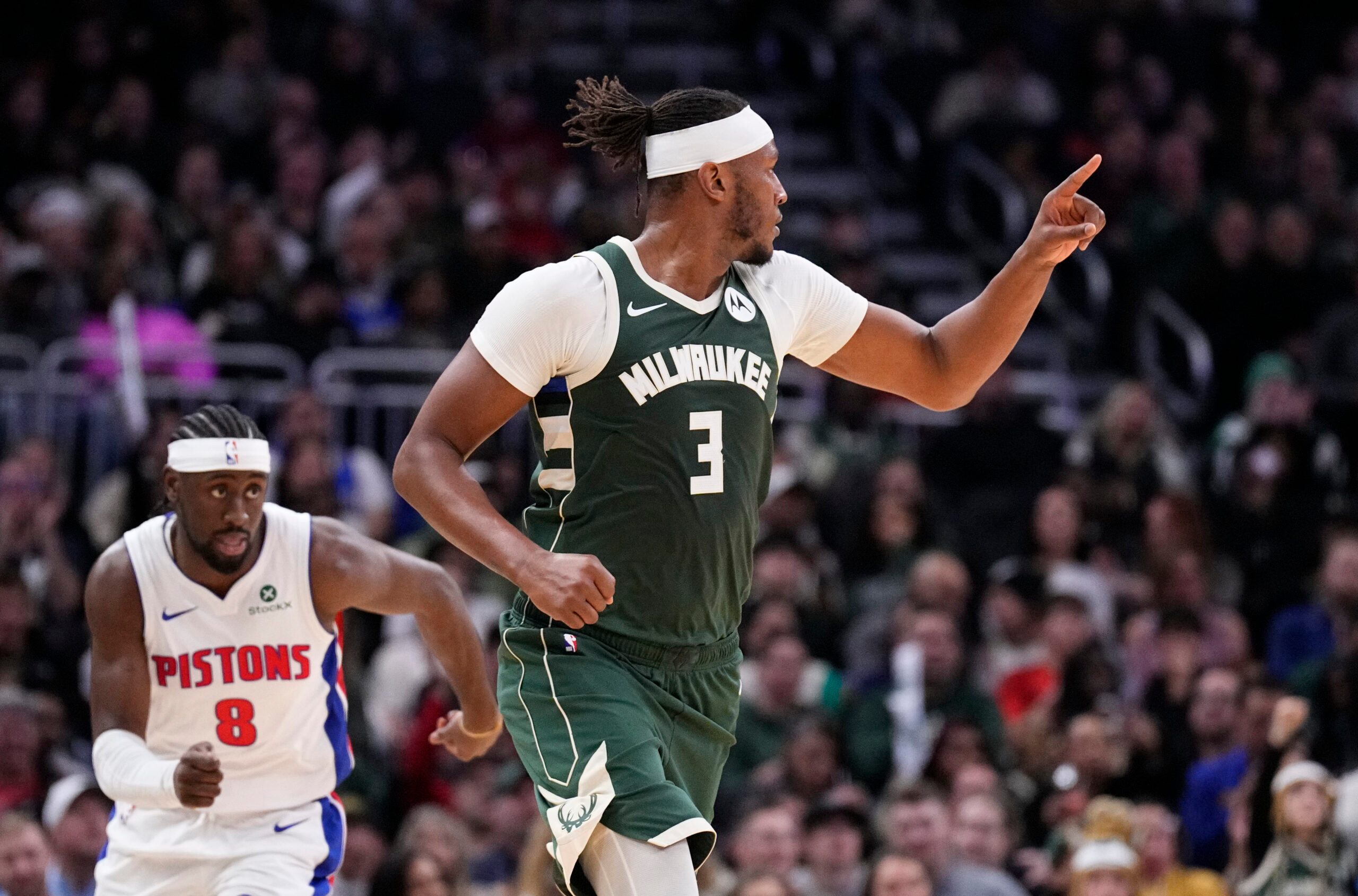Nov 22, 2025; Milwaukee, Wisconsin, USA; Milwaukee Bucks center/forward Myles Turner (3) celebrates making a basket against Detroit Pistons guard Caris Levert (8) in the second half at Fiserv Forum. Mandatory Credit: Michael McLoone-Imagn Images