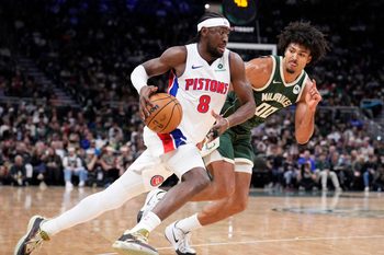Nov 22, 2025; Milwaukee, Wisconsin, USA; Detroit Pistons guard Caris Levert (8) drives against Milwaukee Bucks center Jericho Sims (00) in the second half at Fiserv Forum. Mandatory Credit: Michael McLoone-Imagn Images