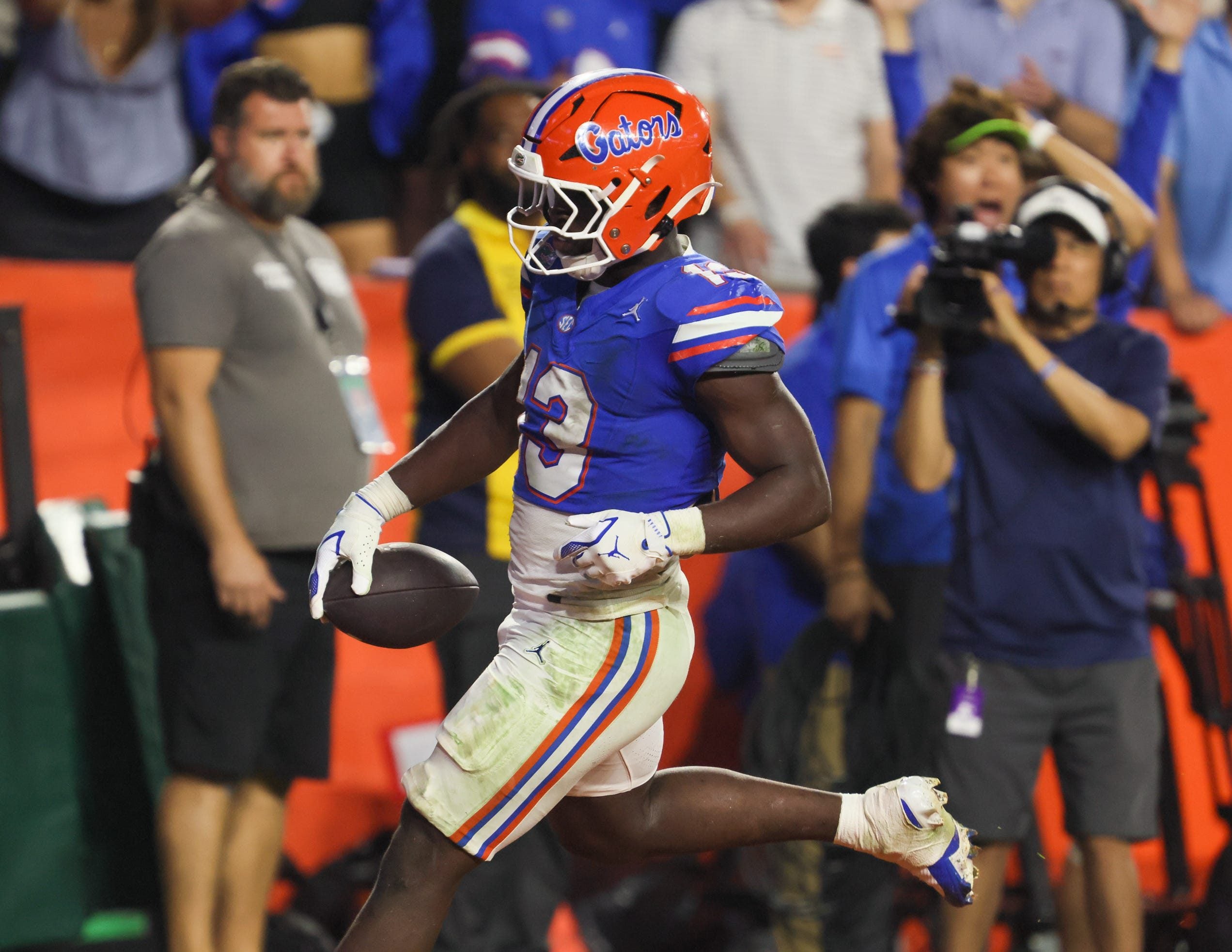 Florida running back Jadan Baugh (13) runs in for a touchdown during the second half of an NCAA football game against Tennessee at Steve Spurrier Field at Ben Hill Griffin Stadium in Gainesville, FL on Saturday, November 22, 2025. Florida lost to Tennessee 31-11[Alan Youngblood/Gainesville Sun]