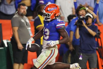 Florida running back Jadan Baugh (13) runs in for a touchdown during the second half of an NCAA football game against Tennessee at Steve Spurrier Field at Ben Hill Griffin Stadium in Gainesville, FL on Saturday, November 22, 2025. Florida lost to Tennessee 31-11[Alan Youngblood/Gainesville Sun]