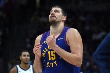 Nov 22, 2025; Denver, Colorado, USA; Denver Nuggets center Nikola Jokic (15) walks back to the bench during a timeout while trailing during the second half against the Sacramento Kings at Ball Arena. Mandatory Credit: Christopher Hanewinckel-Imagn Images