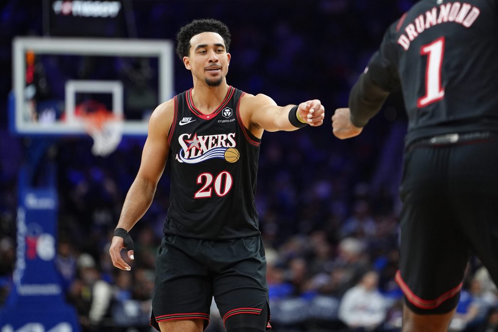 Nov 23, 2025; Philadelphia, Pennsylvania, USA; Philadelphia 76ers guard Jared McCain (20) reacts against the Miami Heat in the third quarter at Xfinity Mobile Arena. Mandatory Credit: Kyle Ross-Imagn Images