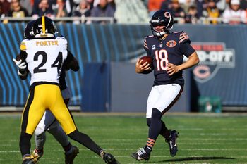Nov 23, 2025; Chicago, Illinois, USA; Chicago Bears quarterback Caleb Williams (18) rushes the ball against the Pittsburgh Steelers during the first half at Soldier Field. Mandatory Credit: Mike Dinovo-Imagn Images