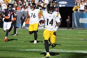 Nov 23, 2025; Chicago, Illinois, USA; Pittsburgh Steelers running back Kenneth Gainwell (14) rushes the ball against the Chicago Bears during the second half at Soldier Field. Mandatory Credit: Mike Dinovo-Imagn Images