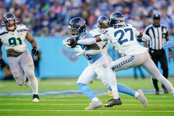 Nov 23, 2025; Nashville, Tennessee, USA; Tennessee Titans running back Tony Pollard (20) runs the ball during the fourth quarter against the Seattle Seahawks  at Nissan Stadium. Mandatory Credit: Andrew Nelles-USA TODAY Network via Imagn Images