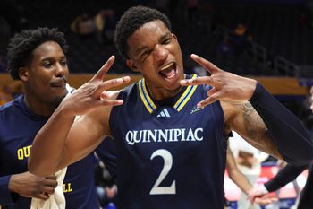 Nov 23, 2025; Pittsburgh, Pennsylvania, USA;  Quinnipiac Bobcats forward Amarri Monroe (2) celebrates after defeating the Pittsburgh Panthers at the Petersen Events Center. Mandatory Credit: Charles LeClaire-Imagn Images