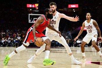 Nov 23, 2025; Cleveland, Ohio, USA; Los Angeles Clippers guard James Harden (1) drives to the basket against Cleveland Cavaliers forward Dean Wade (32) during the second half at Rocket Arena. Mandatory Credit: Ken Blaze-Imagn Images