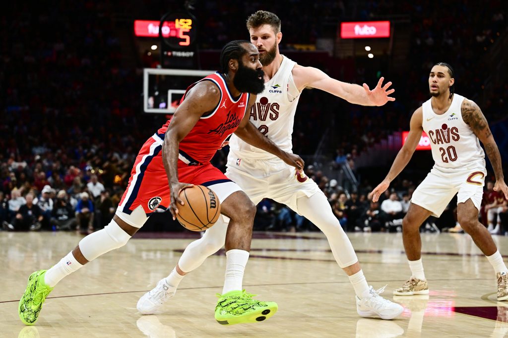 Nov 23, 2025; Cleveland, Ohio, USA; Los Angeles Clippers guard James Harden (1) drives to the basket against Cleveland Cavaliers forward Dean Wade (32) during the second half at Rocket Arena. Mandatory Credit: Ken Blaze-Imagn Images