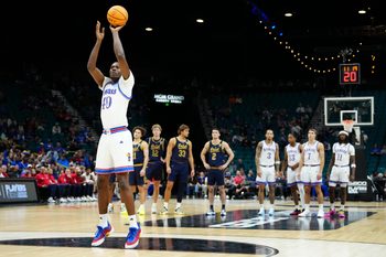 Nov 24, 2025; Las Vegas, Nevada, USA; Kansas Jayhawks forward Flory Bidunga (40) shoots technical foul free throws against the Notre Dame Fighting Irish during the first half in a 2025 Players Era Festival group play game at MGM Grand Garden Arena. Mandatory Credit: Stephen R. Sylvanie-Imagn Images