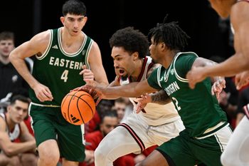 Nov 24, 2025; Louisville, Kentucky, USA; (Editors Notes: Caption Correction) Louisville Cardinals guard J'Vonne Hadley (1) dribbles against Eastern Michigan Eagles guard Carlos Hart (2) during the first half at KFC Yum! Center. Mandatory Credit: Jamie Rhodes-Imagn Images