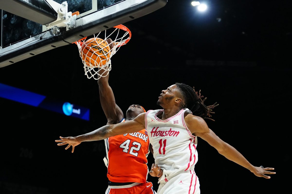 Nov 24, 2025; Las Vegas, Nevada, USA; Syracuse Orange forward William Kyle III (42) drives to the hoop past Houston Cougars forward Joseph Tugler (11) during the second half of a 2025 Players Era Festival group play game at MGM Grand Garden Arena. Mandatory Credit: Stephen R. Sylvanie-Imagn Images