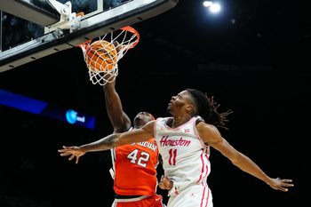 Nov 24, 2025; Las Vegas, Nevada, USA; Syracuse Orange forward William Kyle III (42) drives to the hoop past Houston Cougars forward Joseph Tugler (11) during the second half of a 2025 Players Era Festival group play game at MGM Grand Garden Arena. Mandatory Credit: Stephen R. Sylvanie-Imagn Images