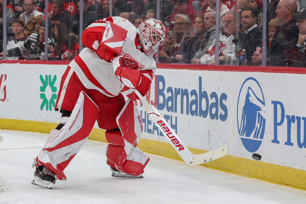 Nov 24, 2025; Newark, New Jersey, USA; Detroit Red Wings goaltender Cam Talbot (39) plays the puck against the New Jersey Devils during the second period at Prudential Center. Mandatory Credit: Ed Mulholland-Imagn Images