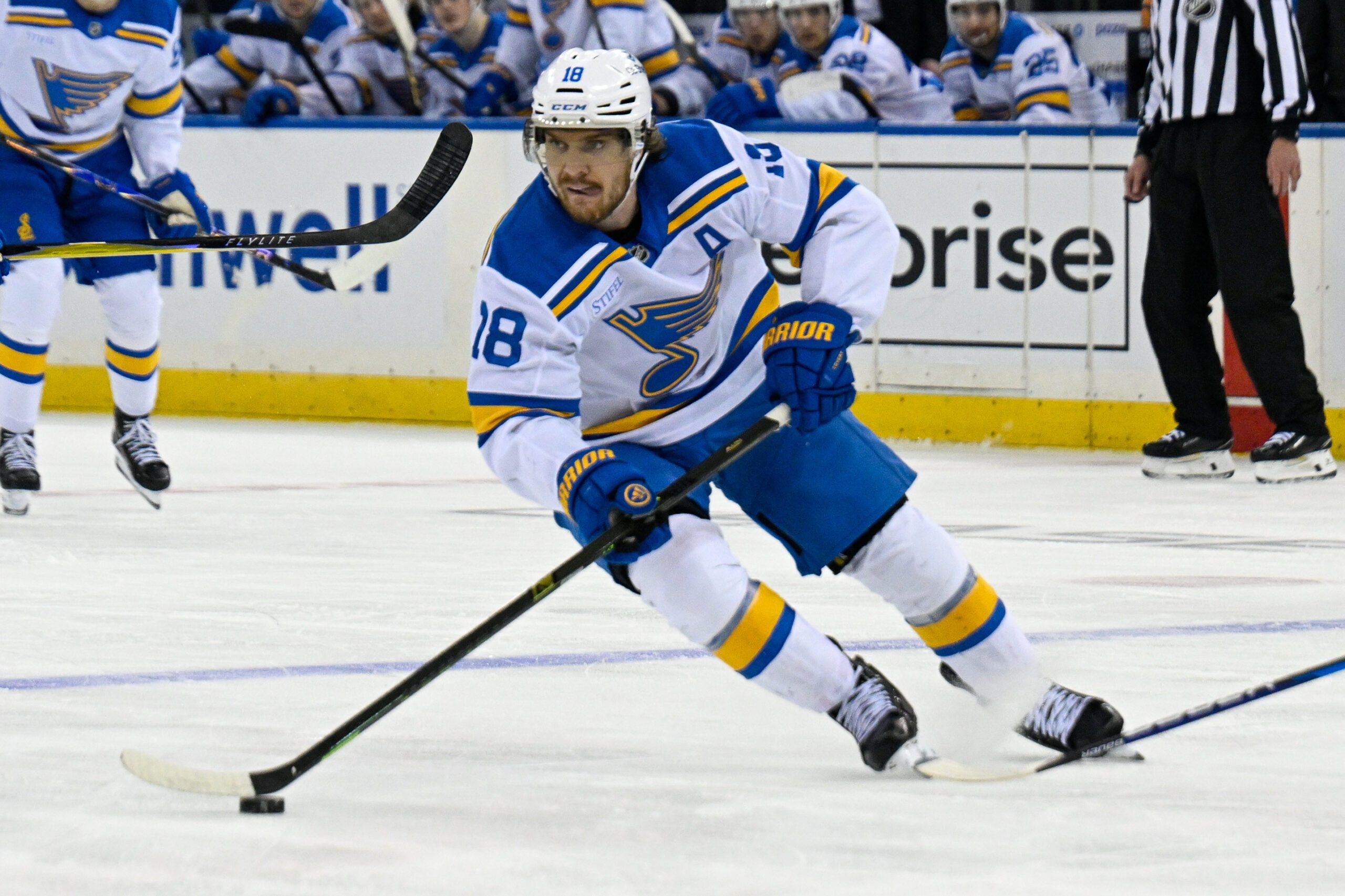Nov 24, 2025; New York, New York, USA; St. Louis Blues center Robert Thomas (18) skates with the puck against the New York Rangers during the third period at Madison Square Garden. Mandatory Credit: Dennis Schneidler-Imagn Images
