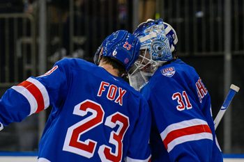 Nov 24, 2025; New York, New York, USA; New York Rangers defenseman Adam Fox (23) celebrates the 3-2 win against the St. Louis Blues with New York Rangers goaltender Igor Shesterkin (31) during the third period at Madison Square Garden. Mandatory Credit: Dennis Schneidler-Imagn Images