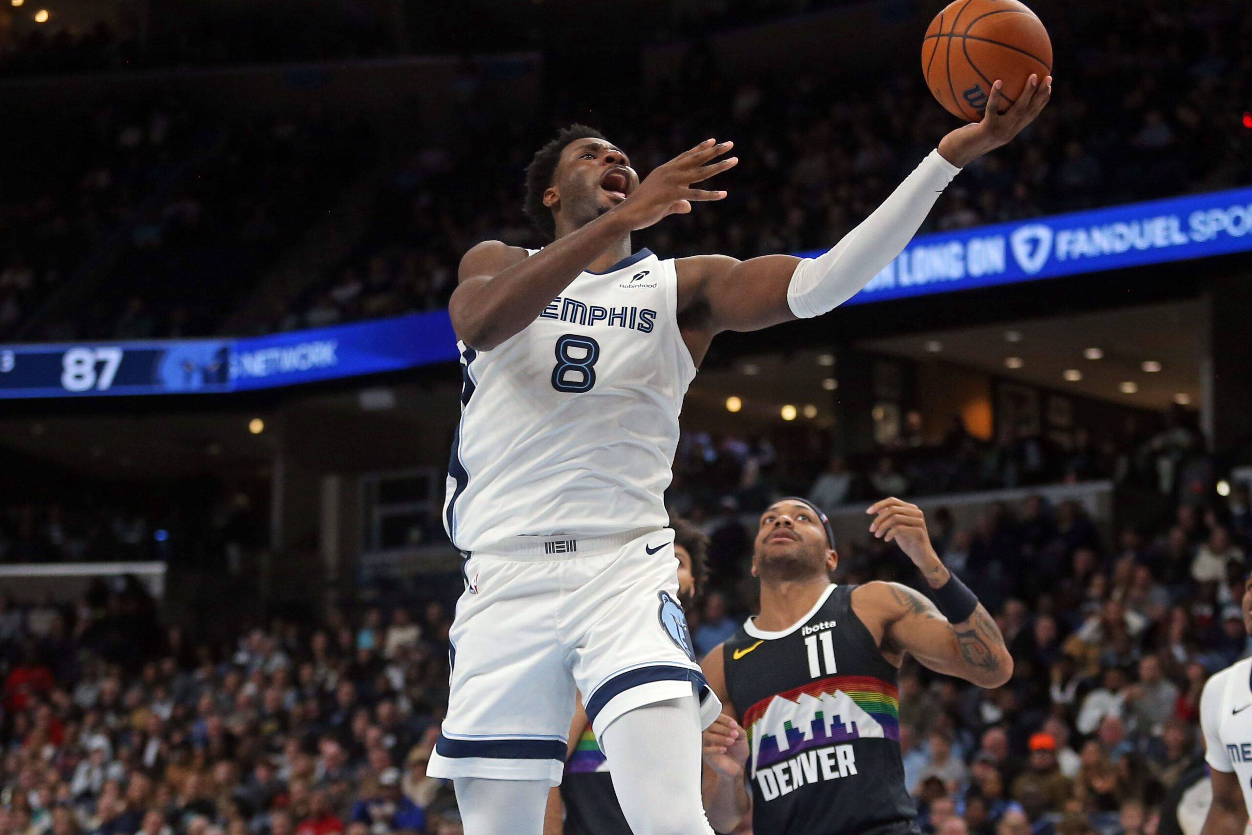 Nov 24, 2025; Memphis, Tennessee, USA; Memphis Grizzlies forward/center Jaren Jackson Jr. (8) shoots during the fourth quarter against the Denver Nuggets at FedExForum. Mandatory Credit: Petre Thomas-Imagn Images