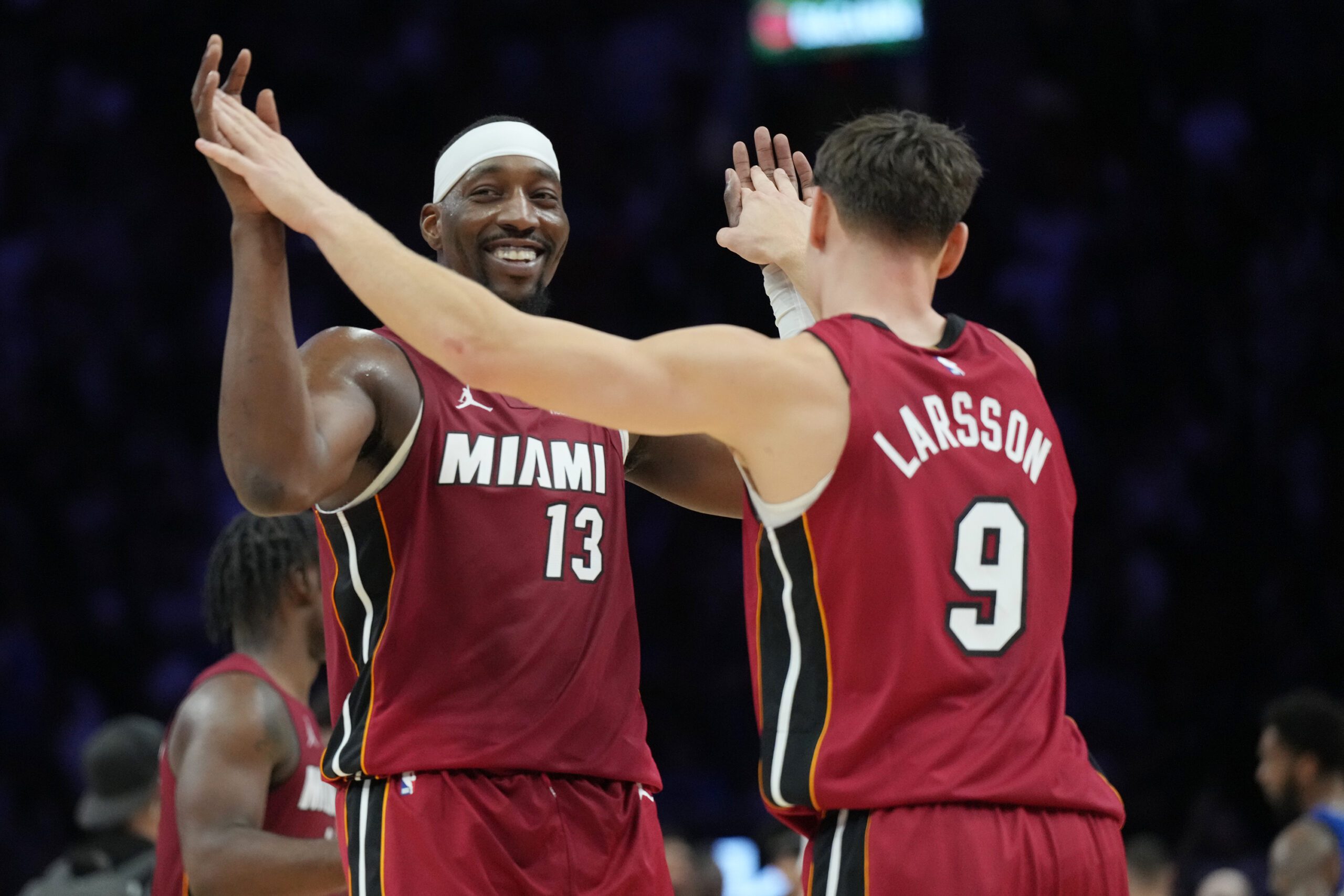 Nov 24, 2025; Miami, Florida, USA; Miami Heat center Bam Adebayo (13) and Miami Heat guard Pelle Larsson (9) celebrate the win over the Dallas Mavericks at Kaseya Center. Mandatory Credit: Jim Rassol-Imagn Images
