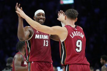 Nov 24, 2025; Miami, Florida, USA; Miami Heat center Bam Adebayo (13) and Miami Heat guard Pelle Larsson (9) celebrate the win over the Dallas Mavericks at Kaseya Center. Mandatory Credit: Jim Rassol-Imagn Images