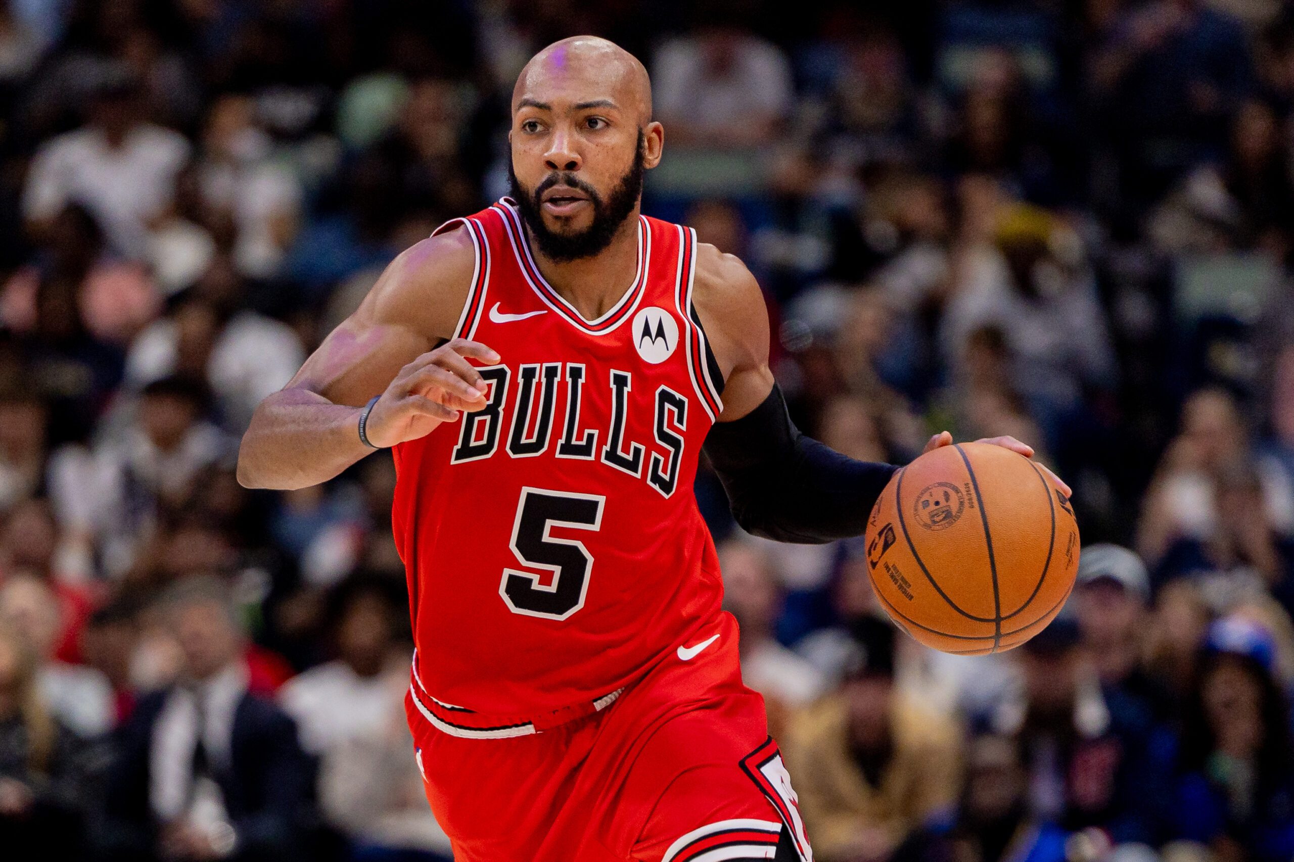 Nov 24, 2025; New Orleans, Louisiana, USA;  Chicago Bulls guard Jevon Carter (5) brings the ball up court against New Orleans Pelicans center Derik Queen (not pictured) during the second half at Smoothie King Center. Mandatory Credit: Stephen Lew-Imagn Images