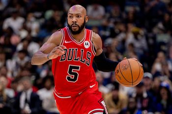 Nov 24, 2025; New Orleans, Louisiana, USA;  Chicago Bulls guard Jevon Carter (5) brings the ball up court against New Orleans Pelicans center Derik Queen (not pictured) during the second half at Smoothie King Center. Mandatory Credit: Stephen Lew-Imagn Images