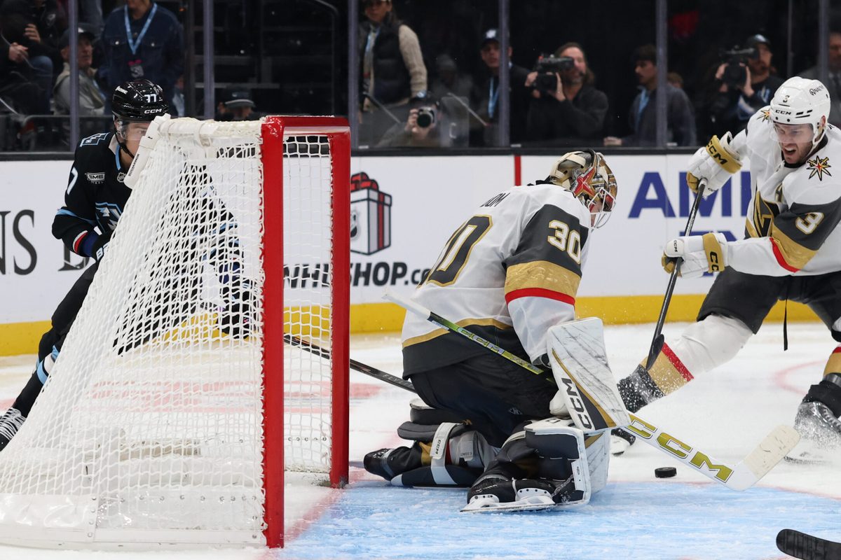 Nov 24, 2025; Salt Lake City, Utah, USA; Vegas Golden Knights goaltender Carl Lindbom (30) makes a save on a shot by Utah Mammoth right wing JJ Peterka (77) during the third period at Delta Center. Mandatory Credit: Rob Gray-Imagn Images