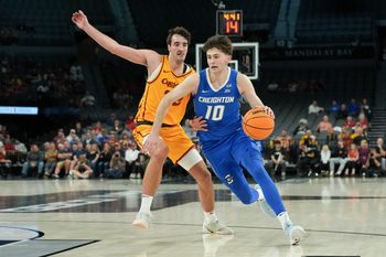 Nov 25, 2025; Las Vegas, Nevada, USA; Creighton Bluejays guard Hudson Greer (10) drives to the basket defended by Iowa State Cyclones forward Milan Momcilovic (22) during the second half in a 2025 Players Era Festival group play game at Michelob Ultra Arena. Mandatory Credit: Kirby Lee-Imagn Images