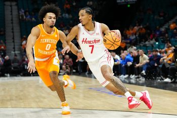 Nov 25, 2025; Las Vegas, NV, USA; Houston Cougars guard Milos Uzan (7) drives to the basket against Tennessee Volunteers guard Ja'Kobi Gillespie (0) in a 2025 Players Era Festival group play game during the first half at MGM Grand Garden Arena. Mandatory Credit: Stephen R. Sylvanie-Imagn Images