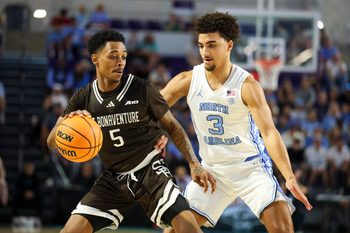 Nov 25, 2025; Fort Myers, Florida, USA; St. Bonaventure Bonnies guard Dasonte Bowen (5) is guarded by North Carolina Tar Heels guard Derek Dixon (3) in the second half at Suncoast Credit Union Arena. Mandatory Credit: Nathan Ray Seebeck-Imagn Images
