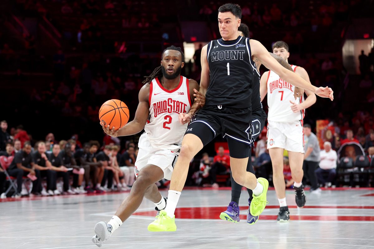 Nov 25, 2025; Columbus, Ohio, USA; Ohio State Buckeyes guard Bruce Thornton (2) looks to pass the ball as Mount St. Mary's Mountaineers forward Anastasios Rozakeas (1) defends during the second half at Value City Arena. Mandatory Credit: Joseph Maiorana-Imagn Images
