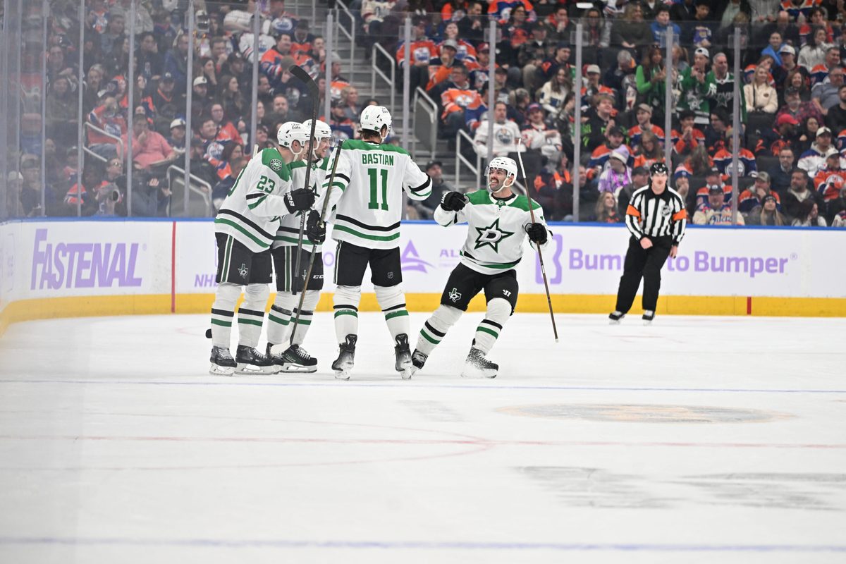 Nov 25, 2025; Edmonton, Alberta, CAN; Dallas Stars (defenceman Esa Lindell 23) with Stars defencemanb Miro Heiskanen (4) Stars centre Colin Blackwell (15) and Stars right winger Nathan Bastian (11) celebrate a goal during the first period at Rogers Place. Mandatory Credit: Walter Tychnowicz-Imagn Images