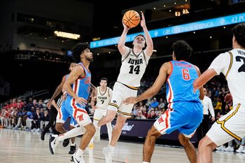 Iowa guard Bennett Stirtz (14) drives to the basket against Ole Miss at Acrisure Arena in Palm Desert, Calif., on Nov. 25, 2025.
