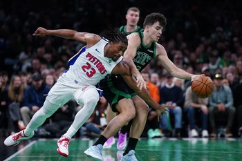 Nov 26, 2025; Boston, Massachusetts, USA; Detroit Pistons guard Jaden Ivey (23) defends against Boston Celtics guard Hugo Gonzalez (28) in the second half at TD Garden. Mandatory Credit: David Butler II-Imagn Images