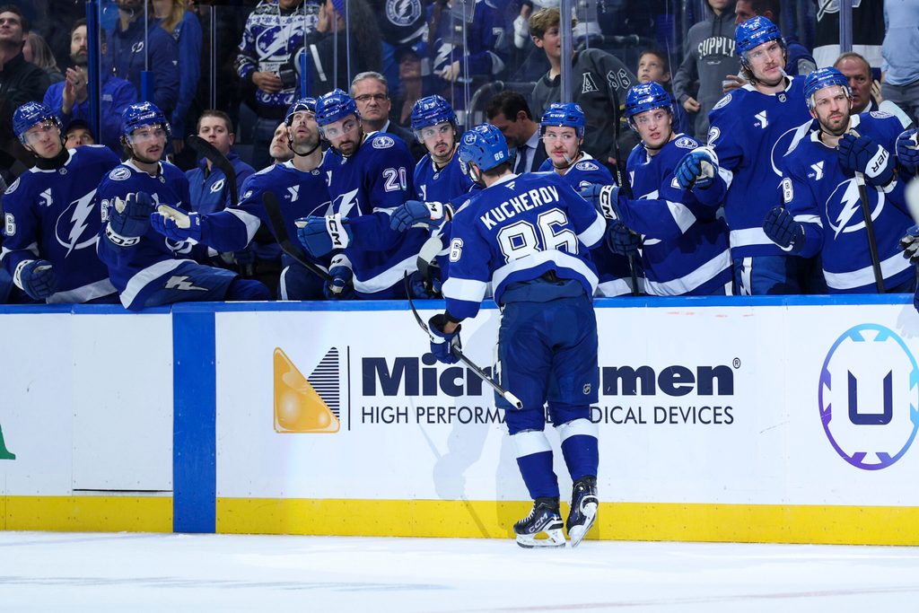 Nov 26, 2025; Tampa, Florida, USA; Tampa Bay Lightning right wing Nikita Kucherov (86) is congratulated after scoring a goal against the Calgary Flames in the third period at Benchmark International Arena. Mandatory Credit: Nathan Ray Seebeck-Imagn Images