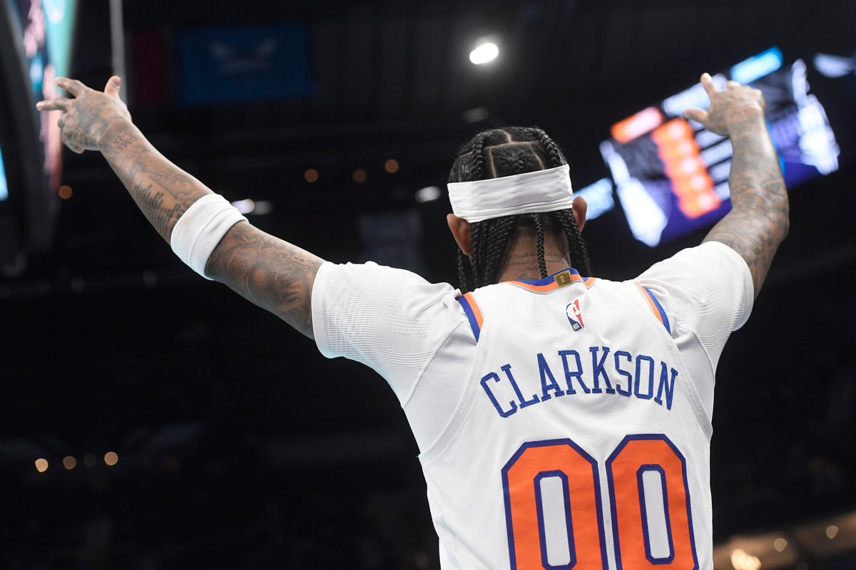 Nov 26, 2025; Charlotte, North Carolina, USA; New York Knicks guard Jordan Clarkson (00) reacts after his team scores during the second half against the Charlotte Hornets at the Spectrum Center. Mandatory Credit: Sam Sharpe-Imagn Images
