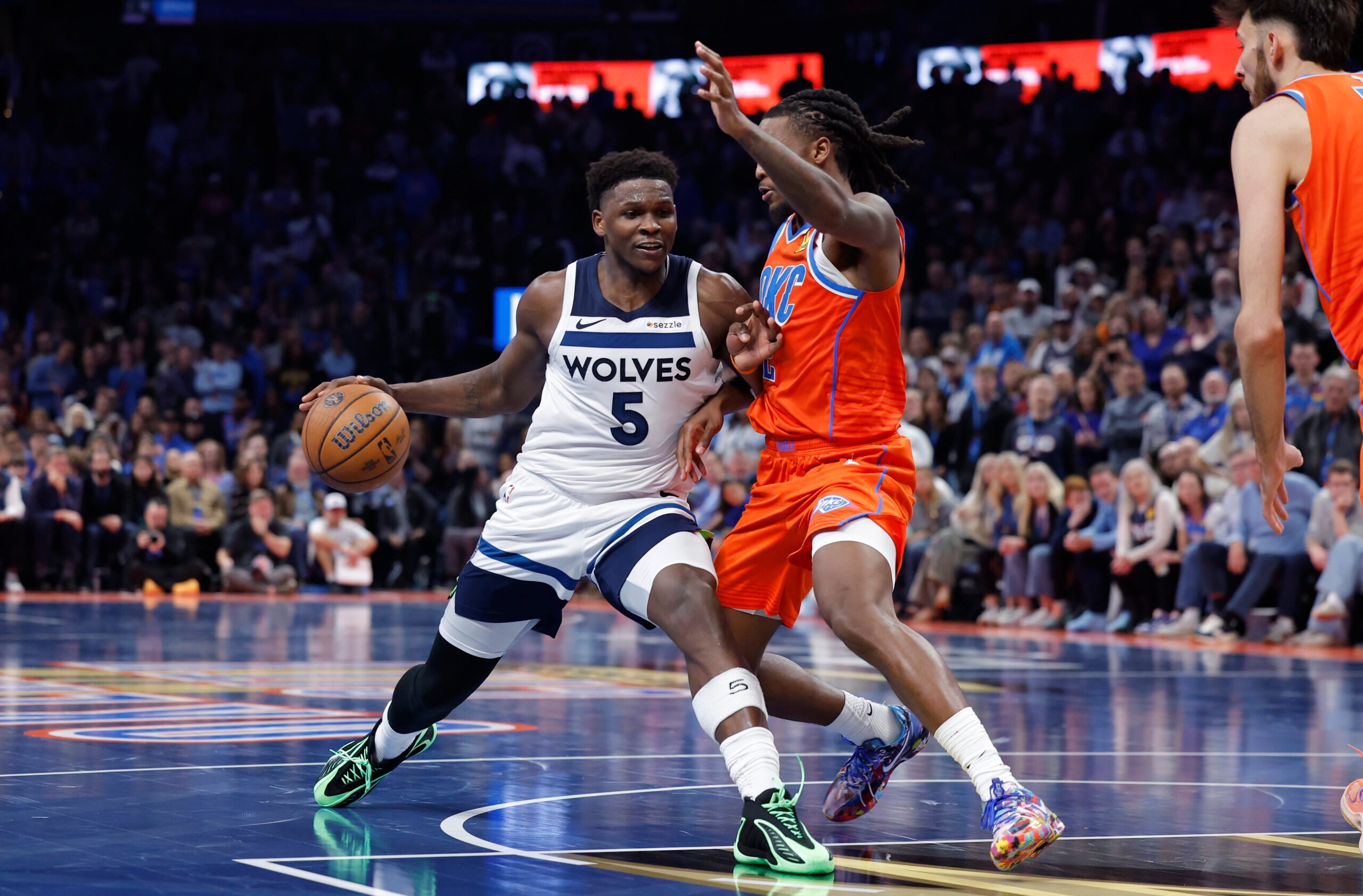Nov 26, 2025; Oklahoma City, Oklahoma, USA; Minnesota Timberwolves guard Anthony Edwards (5) moves to the basket beside Oklahoma City Thunder guard Cason Wallace (22) during the second half at Paycom Center. Mandatory Credit: Alonzo Adams-Imagn Images
