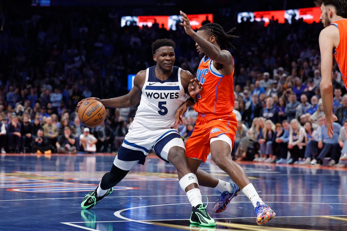 Nov 26, 2025; Oklahoma City, Oklahoma, USA; Minnesota Timberwolves guard Anthony Edwards (5) moves to the basket beside Oklahoma City Thunder guard Cason Wallace (22) during the second half at Paycom Center. Mandatory Credit: Alonzo Adams-Imagn Images