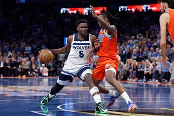 Nov 26, 2025; Oklahoma City, Oklahoma, USA; Minnesota Timberwolves guard Anthony Edwards (5) moves to the basket beside Oklahoma City Thunder guard Cason Wallace (22) during the second half at Paycom Center. Mandatory Credit: Alonzo Adams-Imagn Images