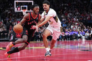 Nov 26, 2025; Toronto, Ontario, CAN; Toronto Raptors guard Immanuel Quickley (5) controls the ball as Indiana Pacers guard Ben Sheppard (26) tries to defend during the third quarter at Scotiabank Arena. Mandatory Credit: Nick Turchiaro-Imagn Images