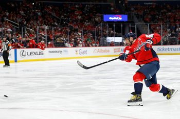 Nov 26, 2025; Washington, District of Columbia, USA; Washington Capitals left wing Alex Ovechkin (8) shoots the puck against the Winnipeg Jets during the third period at Capital One Arena. Mandatory Credit: Geoff Burke-Imagn Images