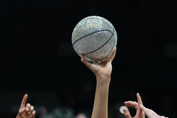 Nov 26, 2025; Las Vegas, NV, USA; A detailed view of the 2025 Players Era Festival trophy lifted up by members of Michigan Wolverines after the championship game against the Gonzaga Bulldogs  at MGM Grand Garden Arena. Mandatory Credit: Kirby Lee-Imagn Images