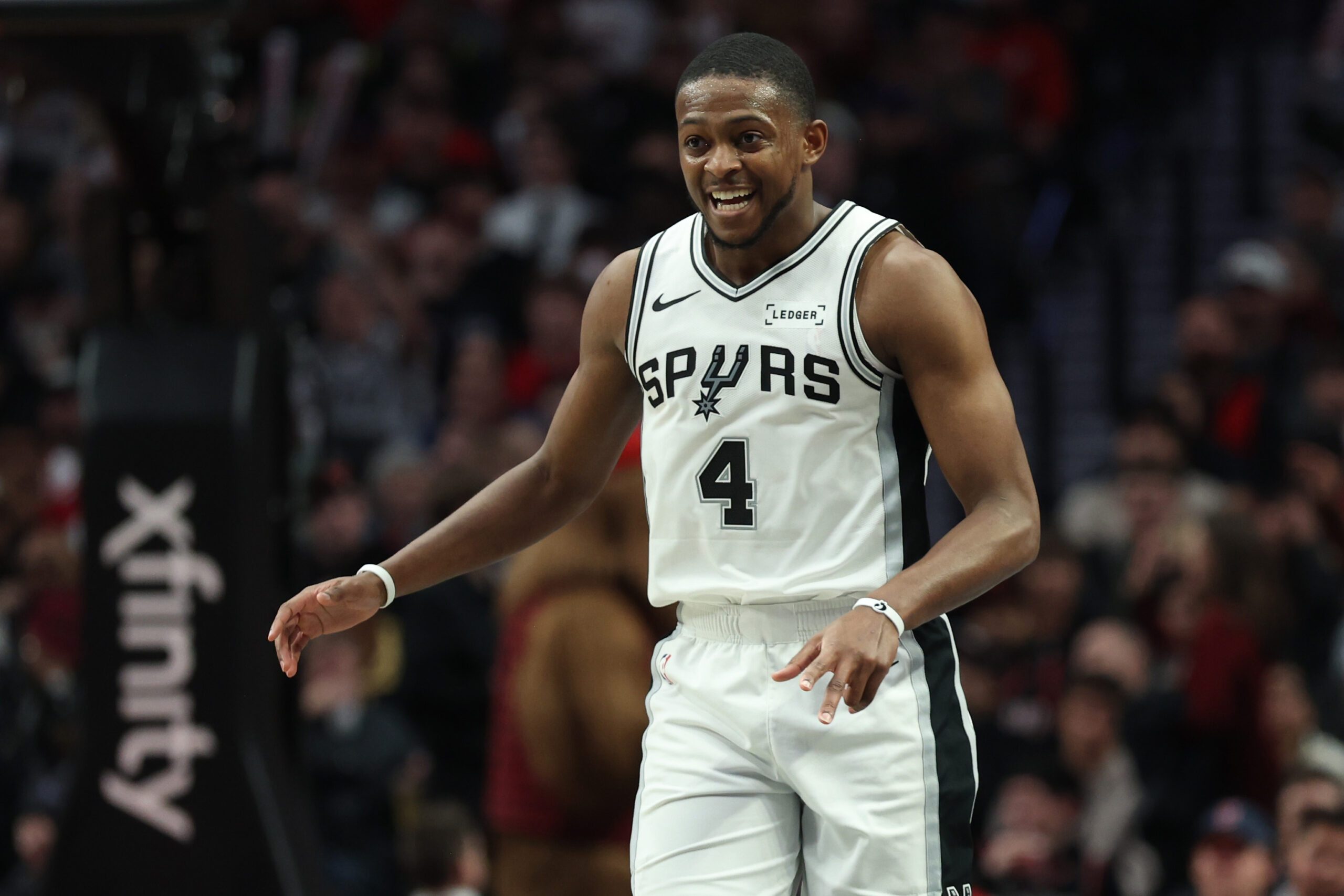 Nov 26, 2025; Portland, Oregon, USA; San Antonio Spurs guard De'Aaron Fox (4) reacts after making a three-point shot in the second half against the Portland Trail Blazers at Moda Center. Mandatory Credit: Jaime Valdez-Imagn Images
