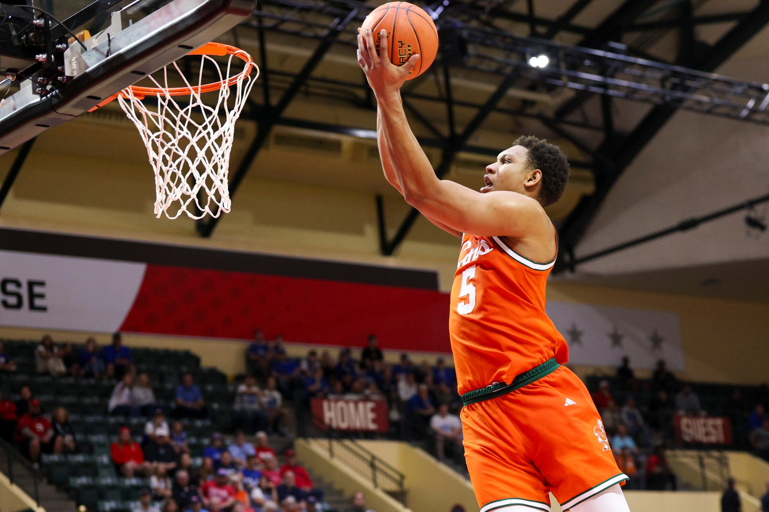 Nov 27, 2025; Kissimmee, Florida, USA; Miami (FL) Hurricanes forward Malik Reneau (5) drives to the hoop against the Brigham Young University Cougars in the first half at State Farm Field House. Mandatory Credit: Nathan Ray Seebeck-Imagn Images